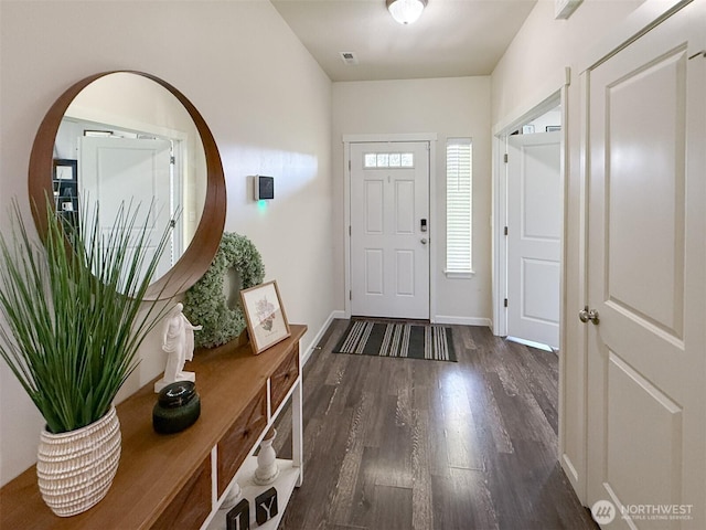 118 Woodview Ln, Napavine, WA 98596 - foyer with dark wood-style flooring, baseboards, visible vents, and arched walkways