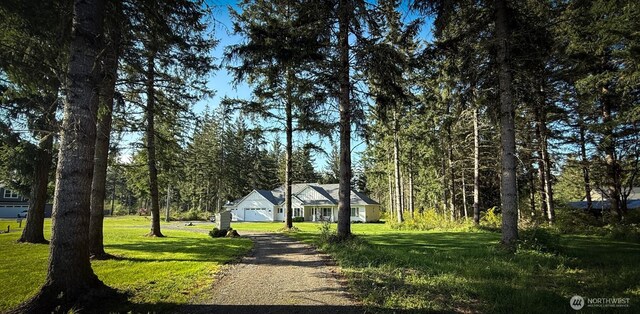 118 Woodview Ln, Napavine, WA 98596 - view of property's community with a garage, a yard, and gravel driveway