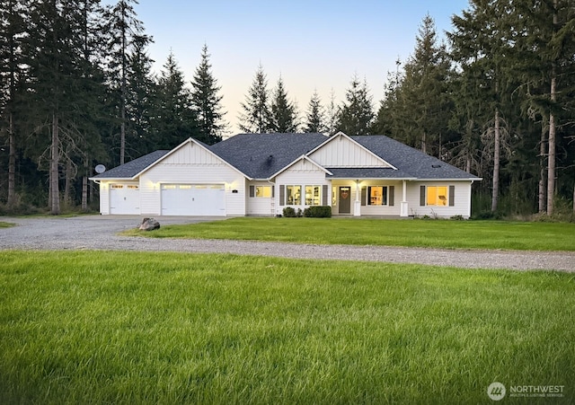 118 Woodview Ln, Napavine, WA 98596 - modern inspired farmhouse featuring driveway, board and batten siding, a garage, a front yard, and a shingled roof