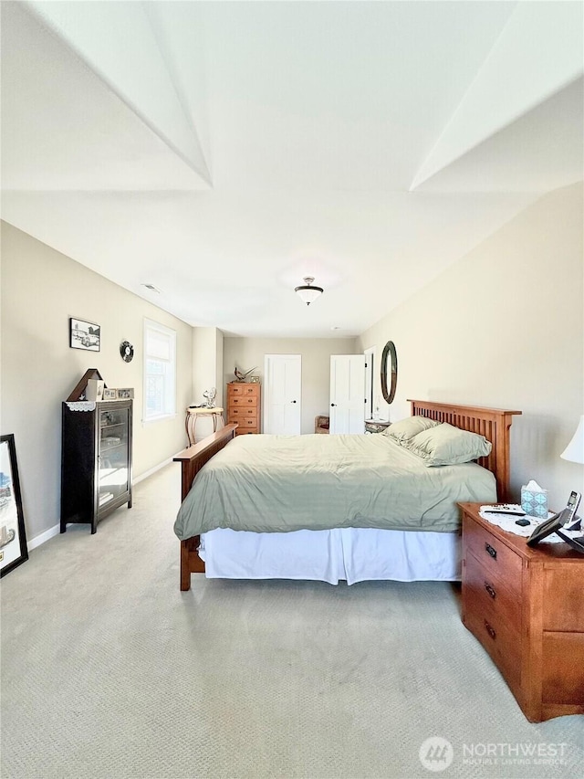bedroom featuring baseboards and carpet flooring