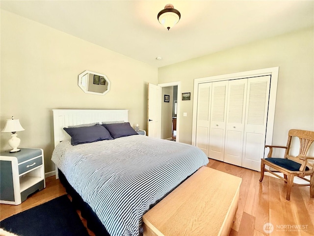 bedroom with a closet and light wood-type flooring