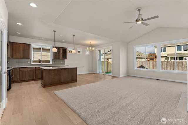 kitchen with a center island, plenty of natural light, and light wood-style flooring