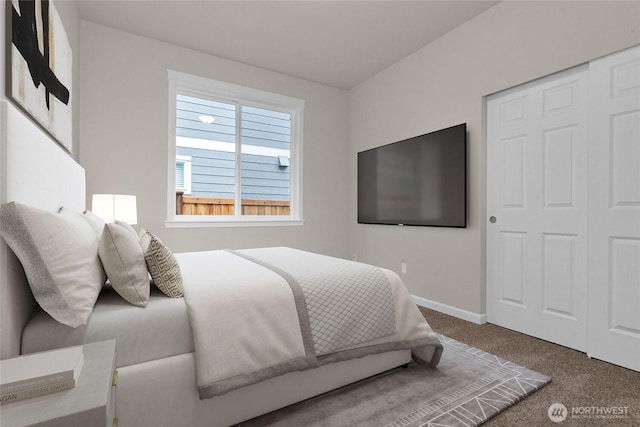 carpeted bedroom featuring baseboards