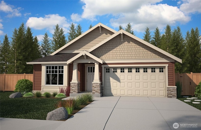craftsman house with concrete driveway, fence, stone siding, and a garage
