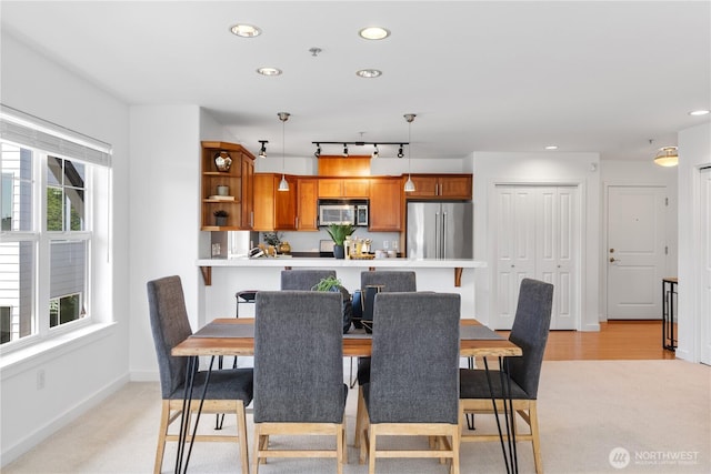 dining room featuring baseboards, recessed lighting, and light colored carpet