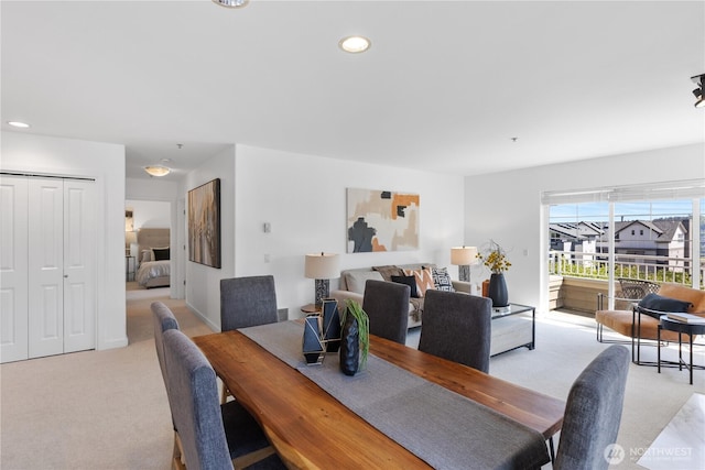 dining area with light carpet and recessed lighting