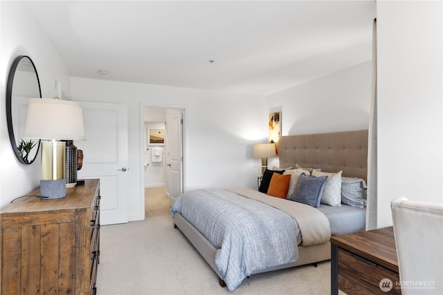 bedroom featuring light carpet