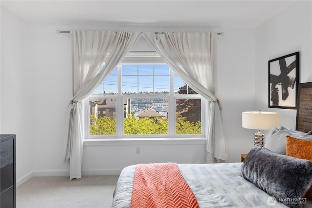 carpeted bedroom with baseboards
