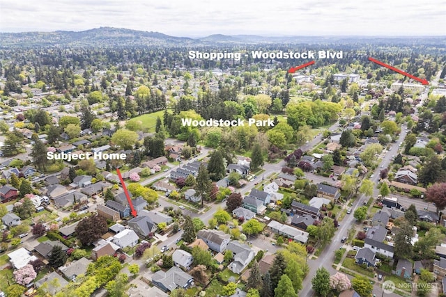 birds eye view of property with a residential view and a mountain view