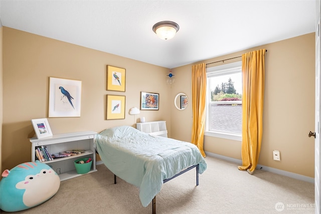 carpeted bedroom with baseboards