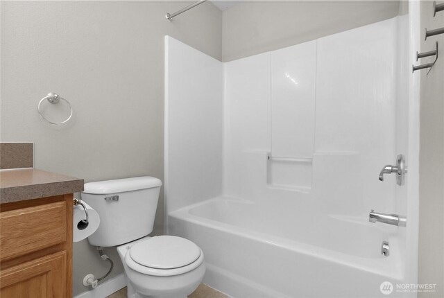 full bathroom with toilet, tub / shower combination, and vanity