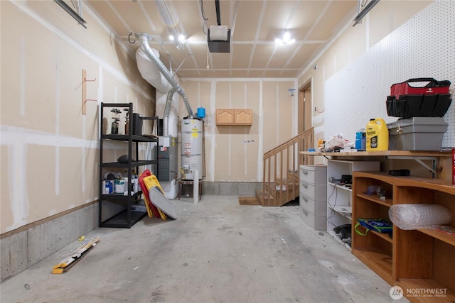 garage with water heater and a garage door opener