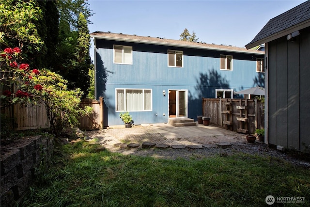 back of property with a patio