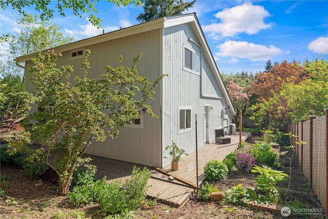 9624 SW Gorsuch Rd, Vashon, WA 98070 - view of side of property with a fenced backyard and cooling unit