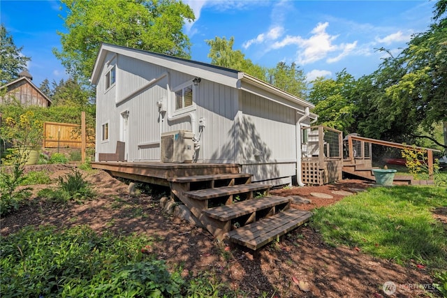 9624 SW Gorsuch Rd, Vashon, WA 98070 - rear view of house featuring a wooden deck and fence