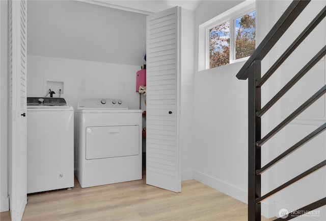 9624 SW Gorsuch Rd, Vashon, WA 98070 - clothes washing area with washer and dryer and light wood finished floors
