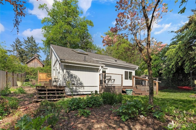 9624 SW Gorsuch Rd, Vashon, WA 98070 - back of house featuring a wooden deck, fence, and a shingled roof