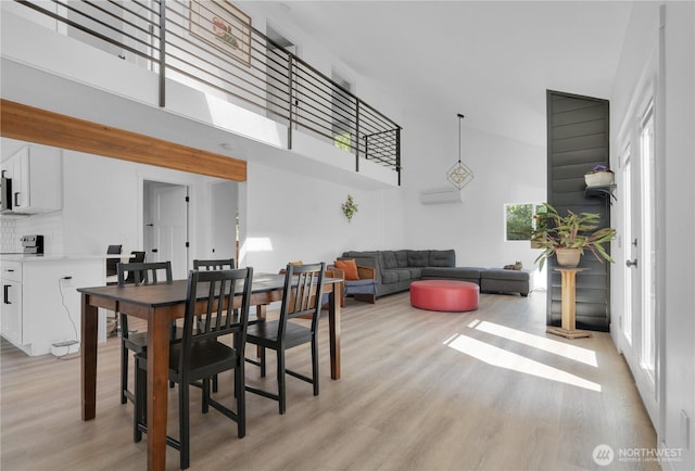 9624 SW Gorsuch Rd, Vashon, WA 98070 - dining area featuring a towering ceiling and light wood-style flooring
