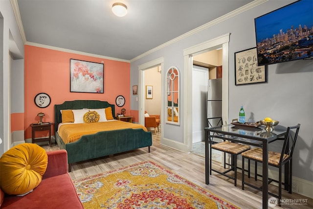 2132 5th Ave Unit 008, Seattle, WA 98121 - bedroom featuring baseboards, ornamental molding, and wood finished floors