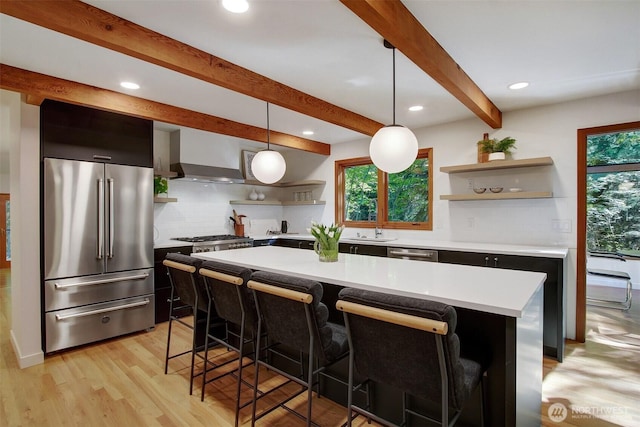 kitchen with stainless steel appliances, open shelves, healthy amount of natural light, beam ceiling, and recessed lighting