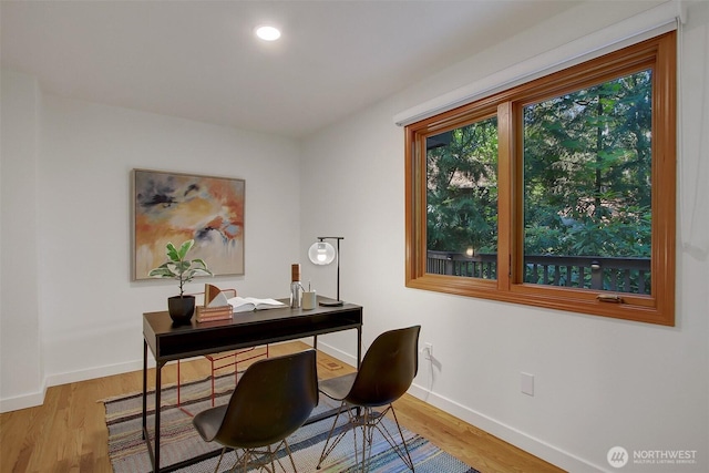 home office featuring baseboards, wood finished floors, and recessed lighting