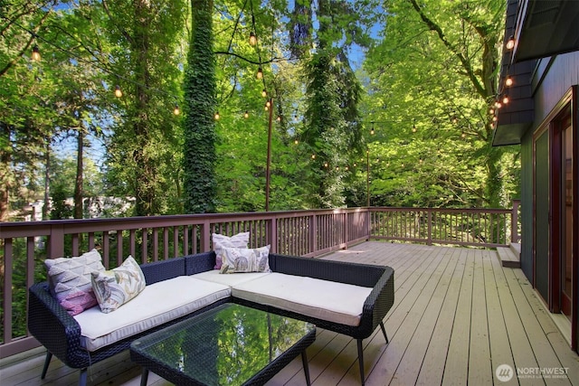 wooden terrace with outdoor lounge area