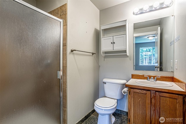 full bath featuring baseboards, a stall shower, toilet, and vanity