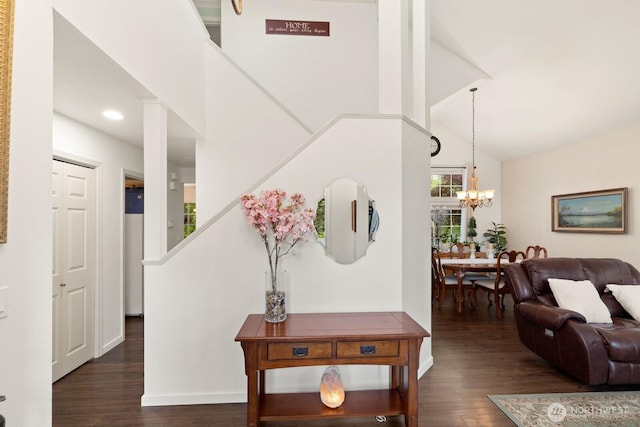 living room with an inviting chandelier, recessed lighting, stairs, and wood finished floors