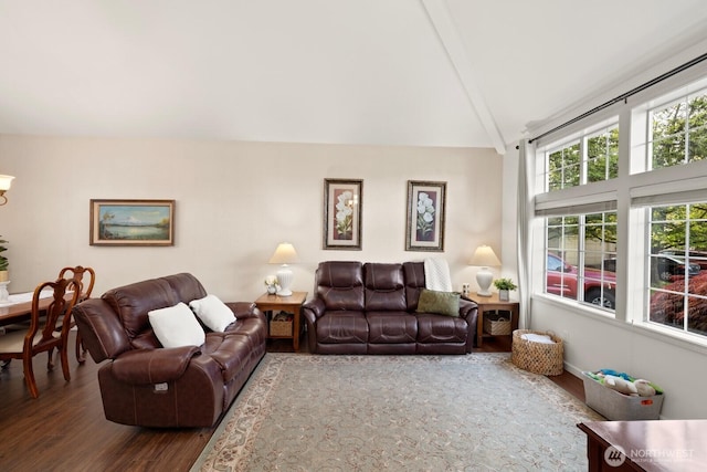 living room with vaulted ceiling with beams and dark wood-style floors
