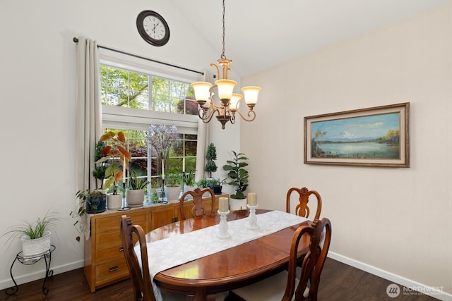 dining space featuring baseboards, dark wood-style flooring, lofted ceiling, and a notable chandelier