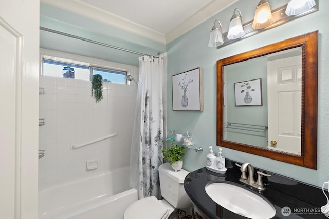full bathroom with shower / bath combo with shower curtain, toilet, and a sink