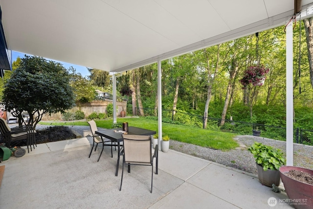 view of patio featuring outdoor dining area and a fenced backyard