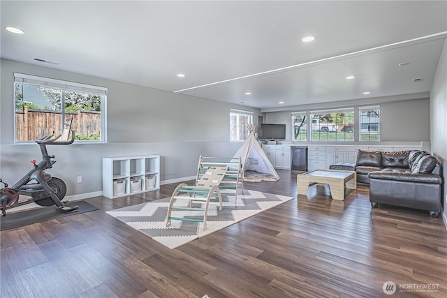 playroom with wood finished floors, visible vents, baseboards, and recessed lighting