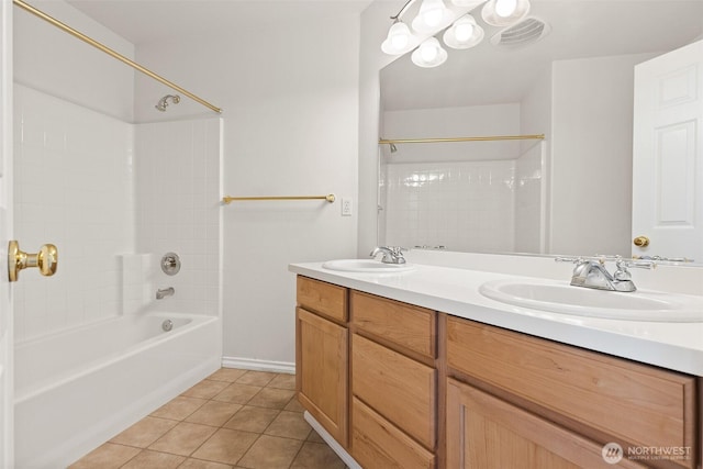 bathroom with double vanity,  shower combination, a sink, and tile patterned flooring