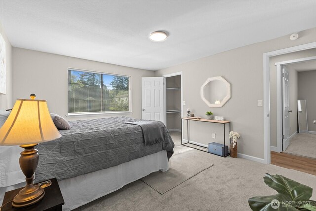 carpeted bedroom featuring baseboards