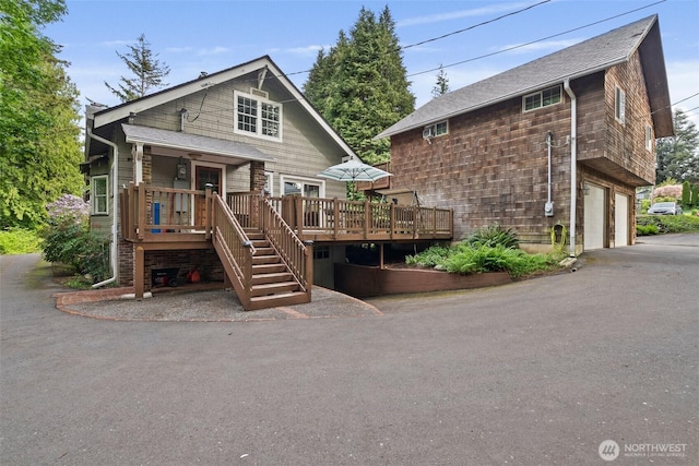 505 S 8th, Shelton, WA 98584 - back of house featuring a deck, an attached garage, stairs, and driveway