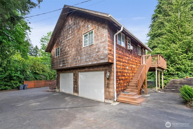 505 S 8th, Shelton, WA 98584 - view of home's exterior with driveway, an attached garage, stairs, and a deck