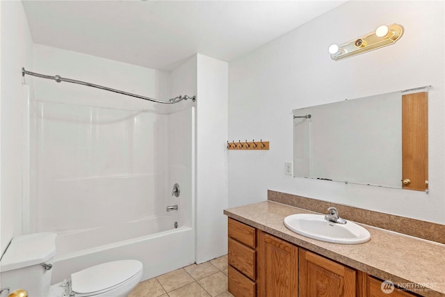 full bathroom with tile patterned floors, shower / bathing tub combination, vanity, and toilet