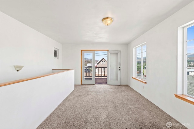 unfurnished room featuring carpet