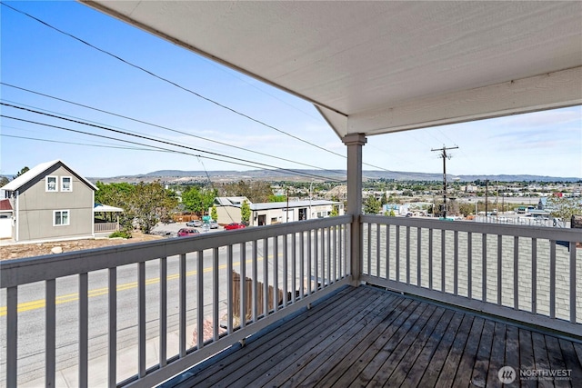 wooden deck with a mountain view
