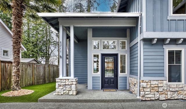 6211 116th Ave NE, Kirkland, WA 98033 - view of exterior entry with stone siding, board and batten siding, and a porch