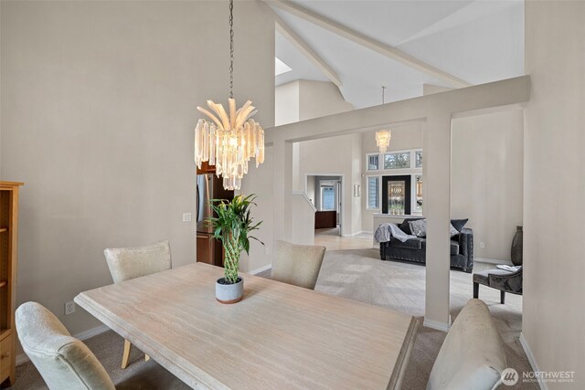 6211 116th Ave NE, Kirkland, WA 98033 - dining area featuring a chandelier, baseboards, light carpet, and high vaulted ceiling