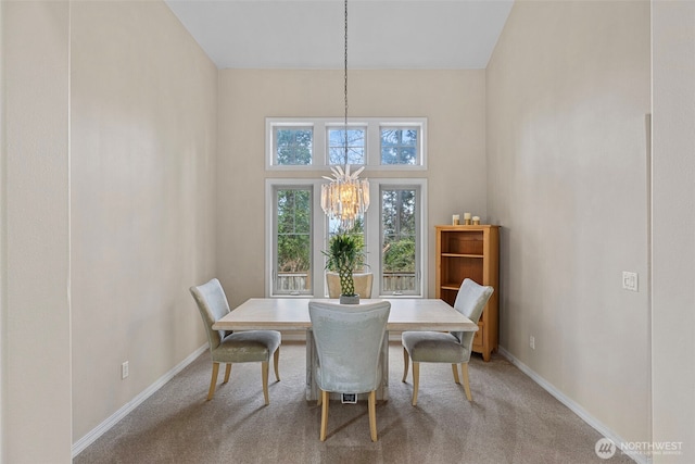 6211 116th Ave NE, Kirkland, WA 98033 - carpeted dining area featuring a chandelier and baseboards