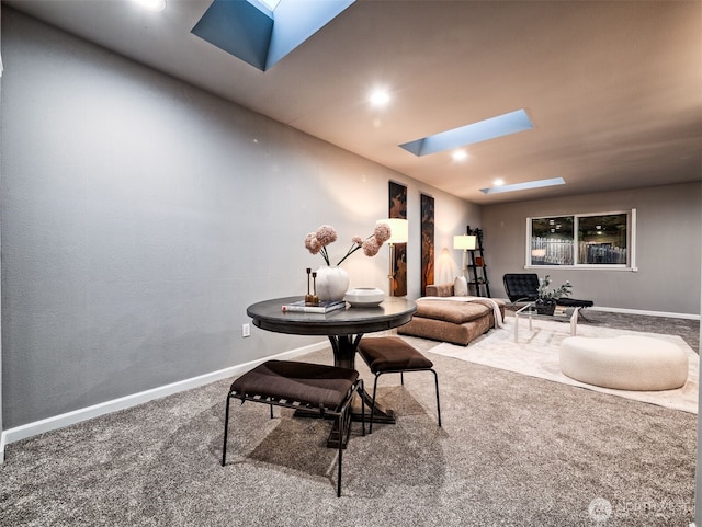 interior space with recessed lighting, a skylight, baseboards, and carpet