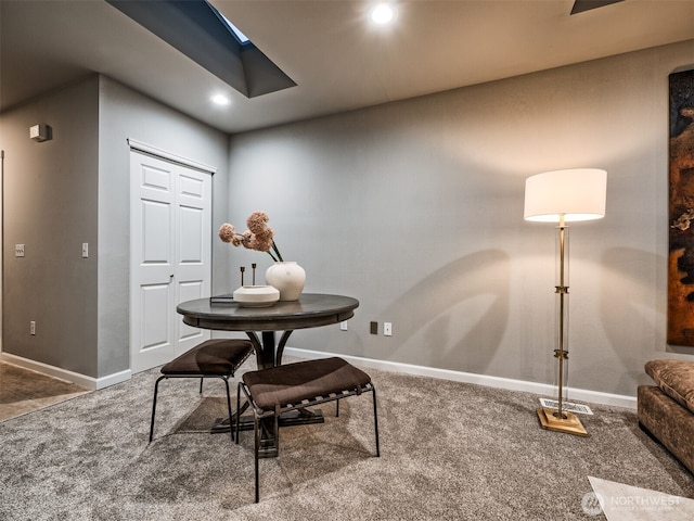 interior space with baseboards and recessed lighting