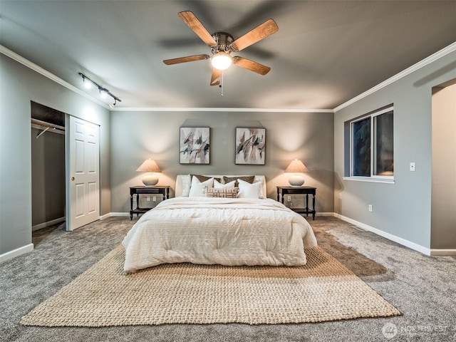 carpeted bedroom with baseboards, ornamental molding, rail lighting, and ceiling fan