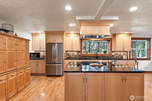 11451 O Ave, Anacortes, WA 98221 - kitchen with dark countertops, a sink, stainless steel appliances, decorative backsplash, and a kitchen island