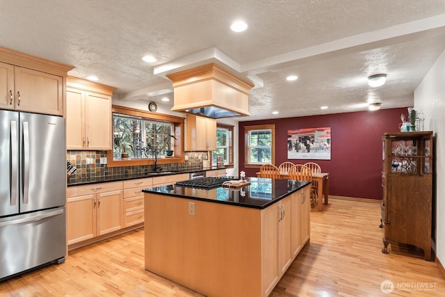 11451 O Ave, Anacortes, WA 98221 - kitchen with light wood finished floors, freestanding refrigerator, recessed lighting, and a textured ceiling