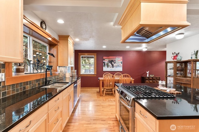 11451 O Ave, Anacortes, WA 98221 - kitchen with backsplash, light wood-type flooring, a sink, light brown cabinets, and stainless steel appliances