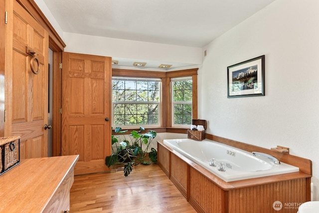 11451 O Ave, Anacortes, WA 98221 - bathroom featuring a garden tub and wood finished floors